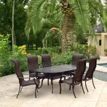 Du Monde 7 Piece Banana Leaf Wicker Patio Dining Set W/ 84 X 42 Inch Oval Dining Table By Lakeview Outdoor Designs image