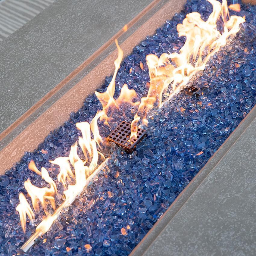 Riviera OFG415LG-LP 60 Inch Rectangular Concrete Propane Fire Pit Table in Gray By Elementi - Fire Glass - On - Close Up View - Detail thumbnail