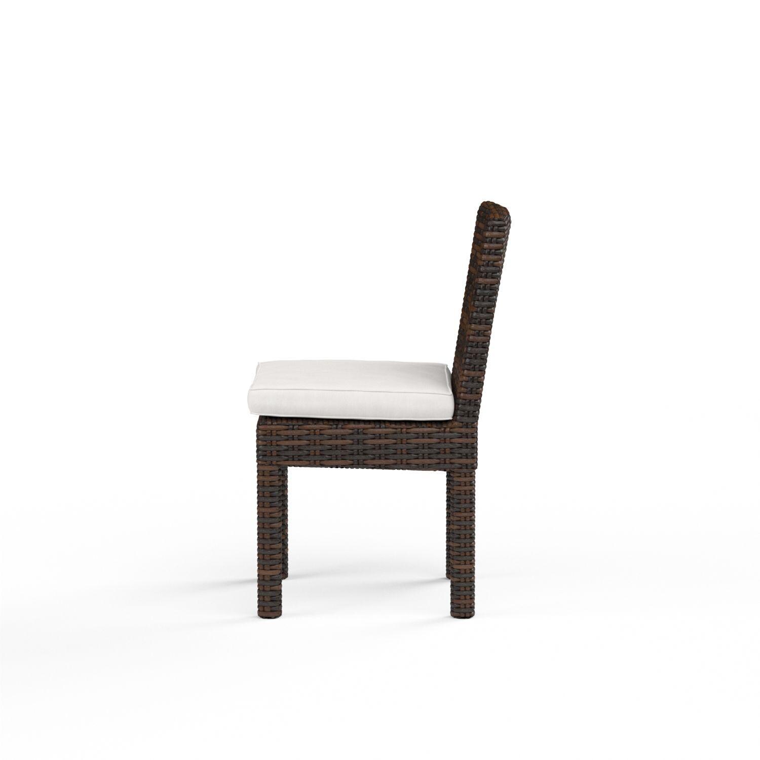 Montecito Wicker Patio Dining Side Chair W/ Sunbrella Canvas Flax Cushion By Sunset West - Side View - White Background thumbnail