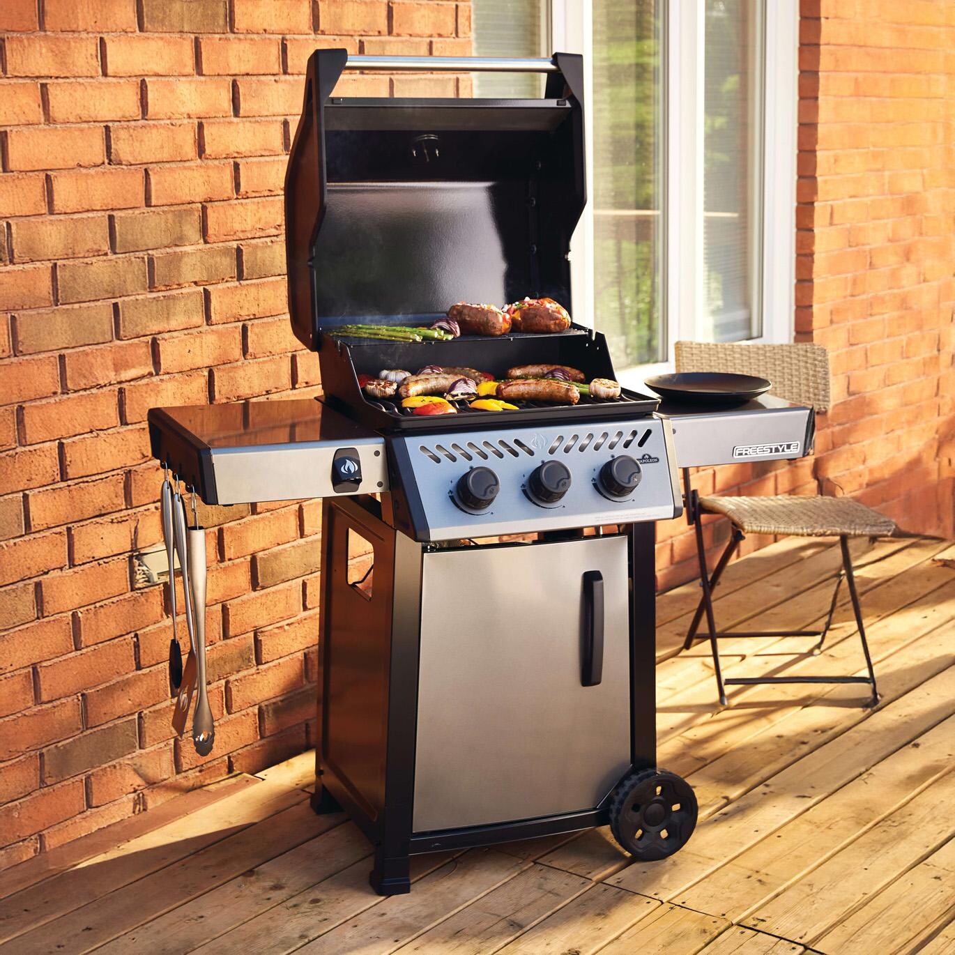 Napoleon F365DNGT Freestyle 365 3 Burner Natural Gas Grill - Graphite Grey - Cooking on Patio - Lifestyle thumbnail