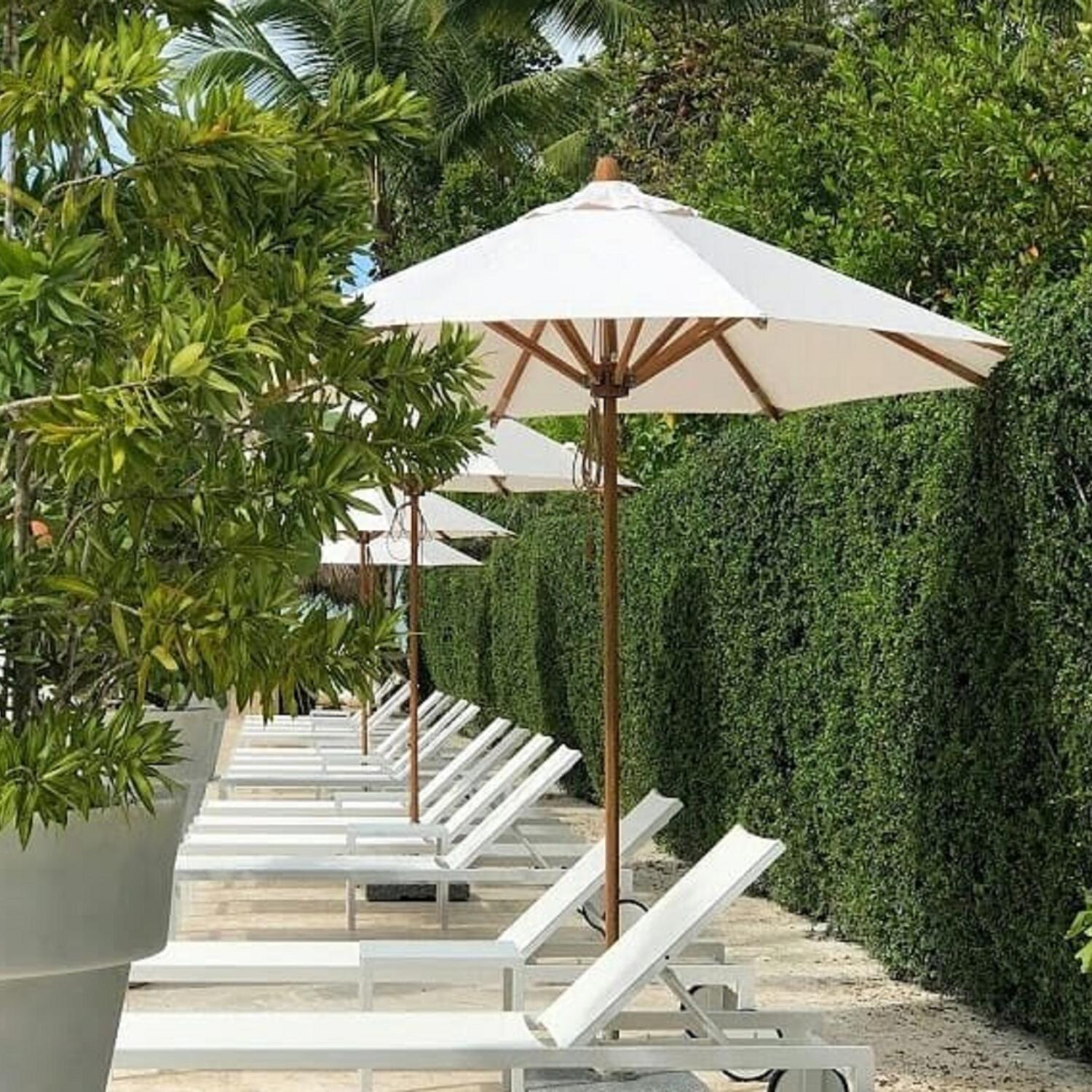 Bambrella 8.5 Ft. Octagonal Bamboo Levante Market Umbrella Set w/ 110 Lb. Freestanding Base in Ice White (Shown in Ecru) - Lifestyle thumbnail