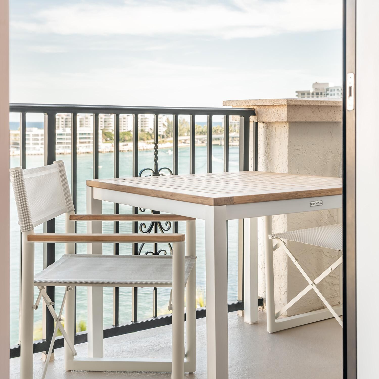 Teak + Table Barbados Director Chair in White - Restaurant Balcony - Lifestyle thumbnail
