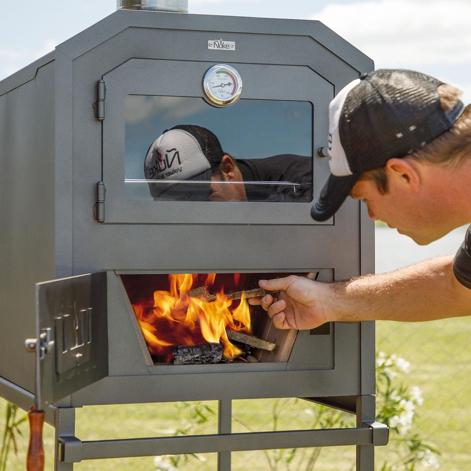 Nuke Wood Fired Outdoor Oven OVEN6003 - Inserting Woodfire - Lifestyle thumbnail