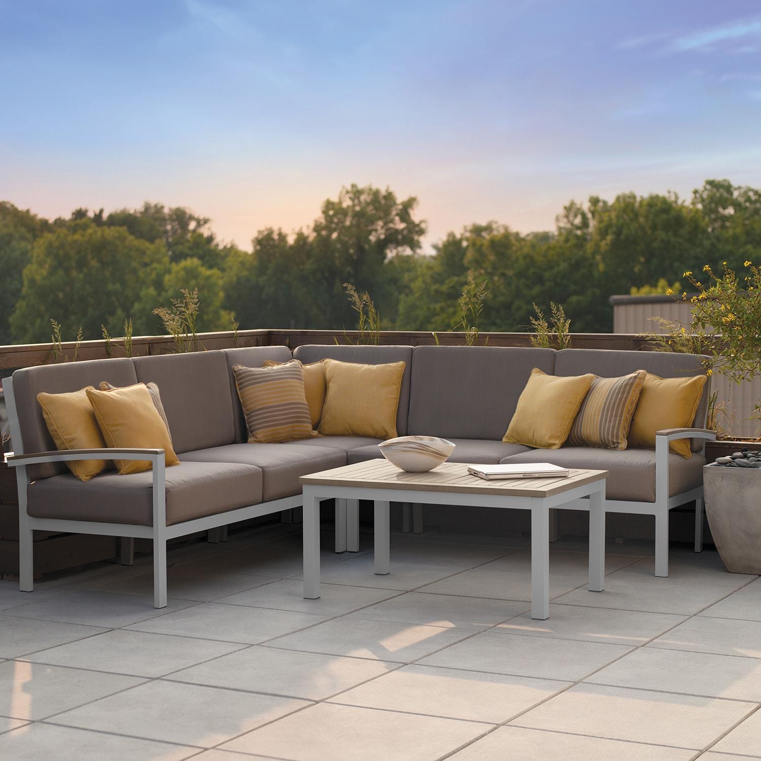 Oxford Garden 5063-PC.F Travira 4 Pc Aluminum Seating Set w/ Coffee Table in Vintage Tekwood by Oxford Garden - On Patio - Lifestyle thumbnail