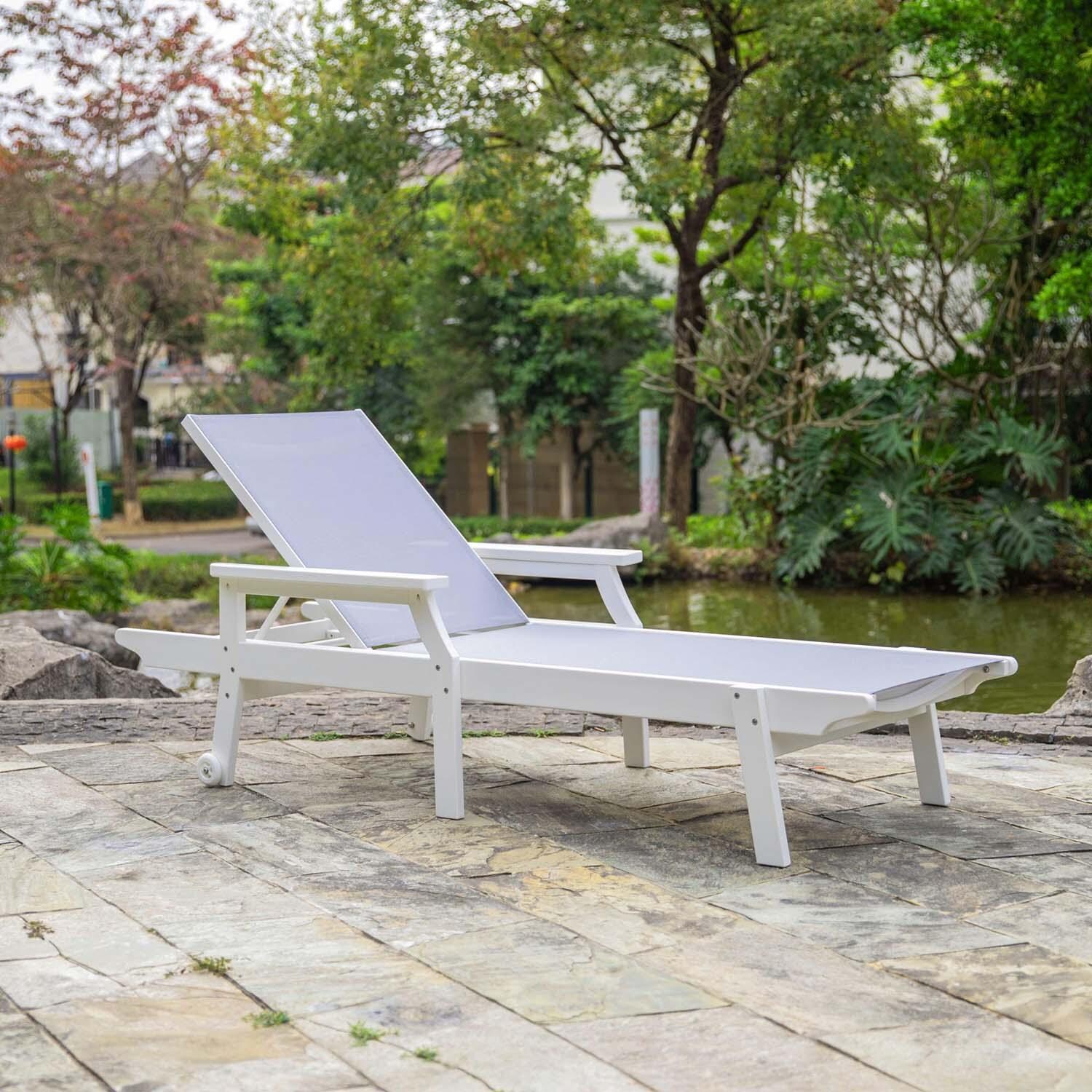 Sandview Polyresin Chaise Lounge w/ Arms By Ultimate Patio - Lifestyle thumbnail