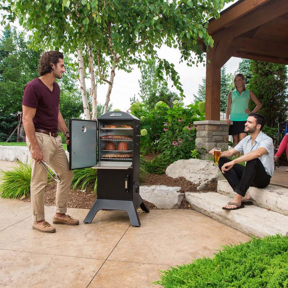 Broil King 28-Inch Smoke Vertical Charcoal Smoker - Black - On Patio - Lifestyle thumbnail