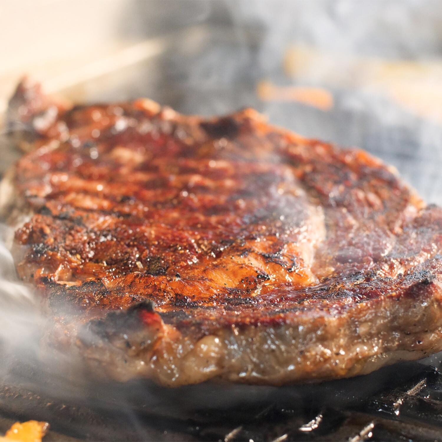 Coyote 18-Inch Built-In / Portable Electric Grill On Patio Post - Grilling Steak thumbnail