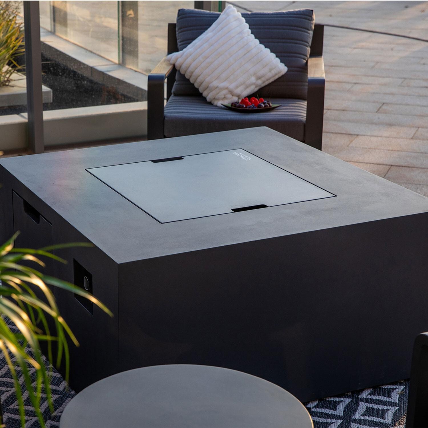 Elementi OFG310DG-LP Rocky 43-in Liquid Propane Concrete Fire Table w/ Hidden Tank in Dark Grey - Lid On - Lifestyle thumbnail