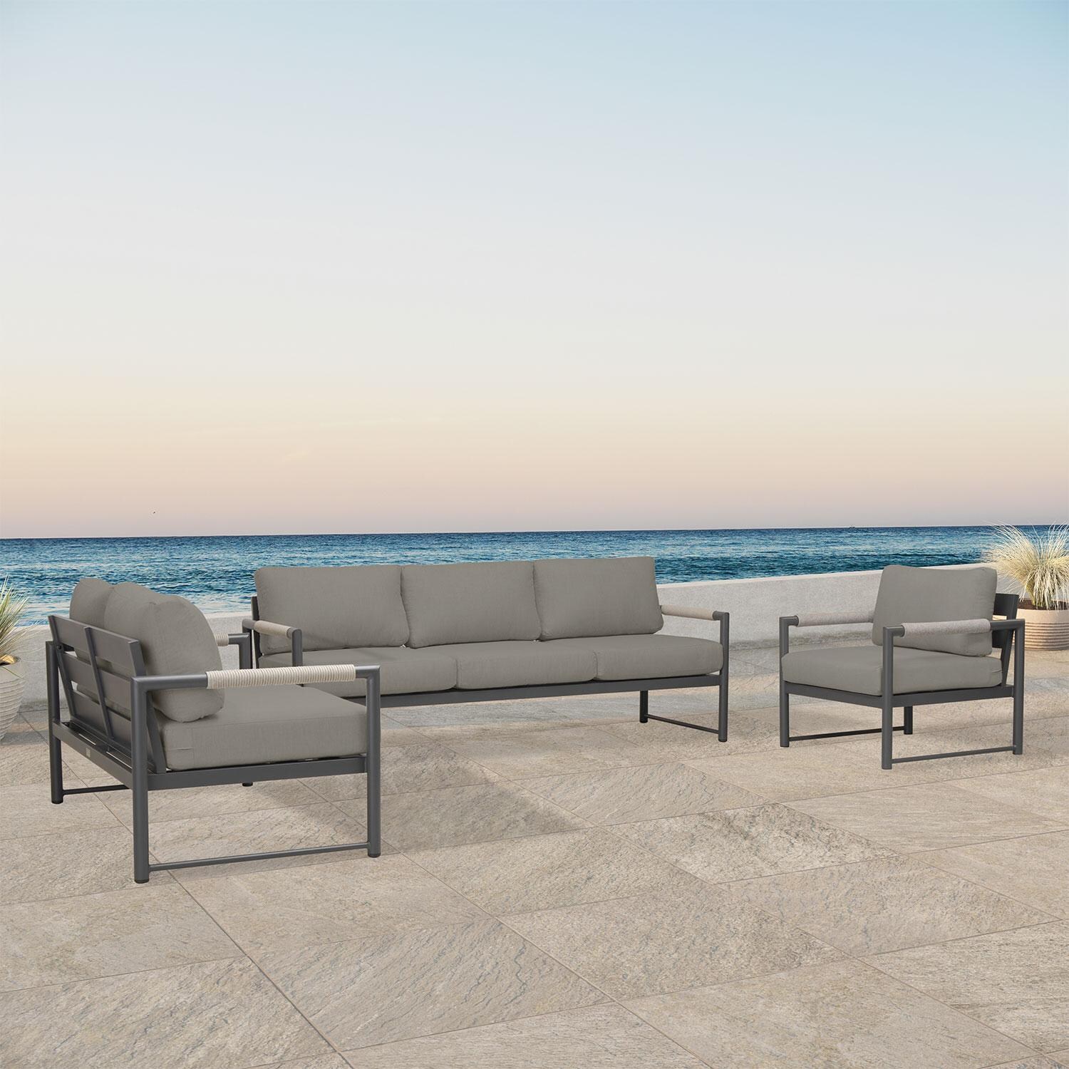 Lakeview AVEBAY-SL-PG-SET143-CC Avenue Bay Slate/Pebble Gray 3 Pc Sofa Loveseat Set - Canvas Charcoal - Angled On Patio - Lifestyle thumbnail