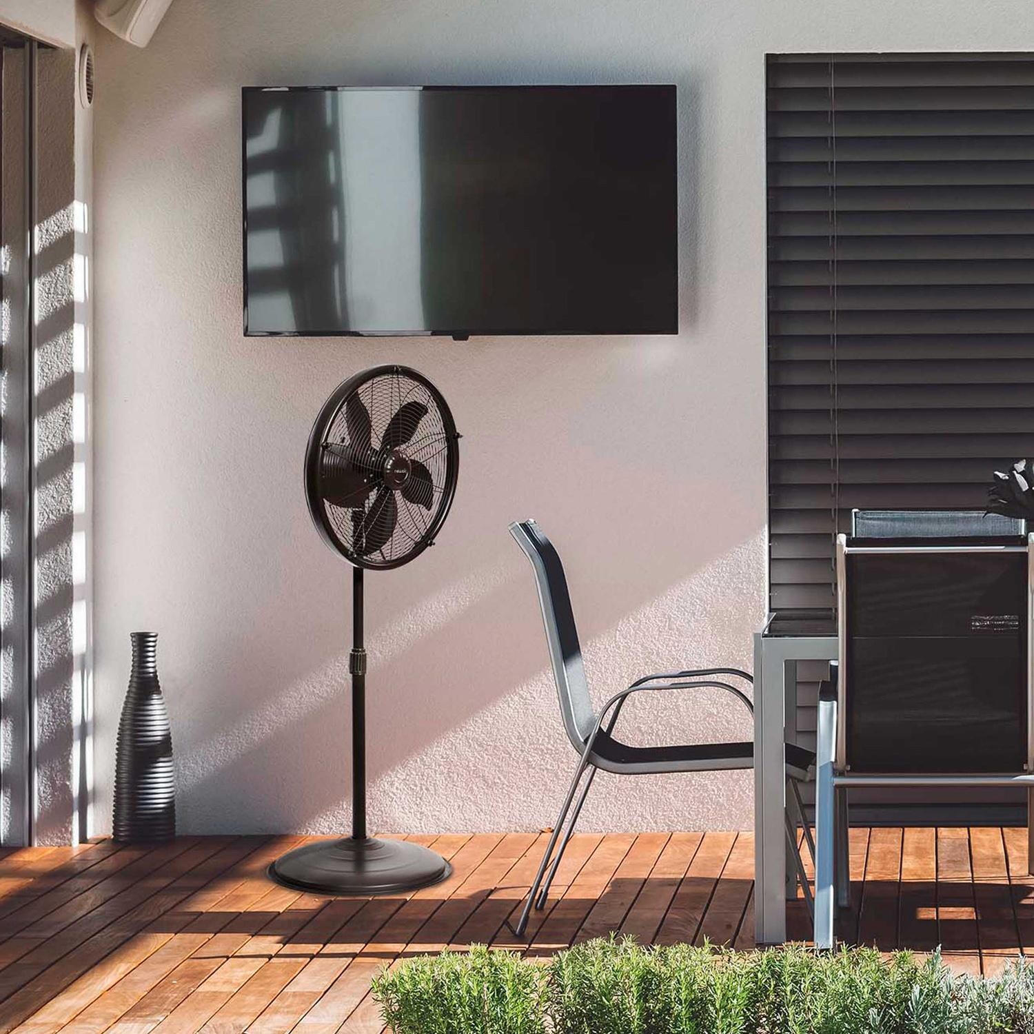 NewAir AF-600 18-in Misting & Oscillating Pedestal Fan for Indoor & Outdoor w/ Adjustable Height & Head Tilt - 2800 CFM - On Patio - Lifestyle thumbnail