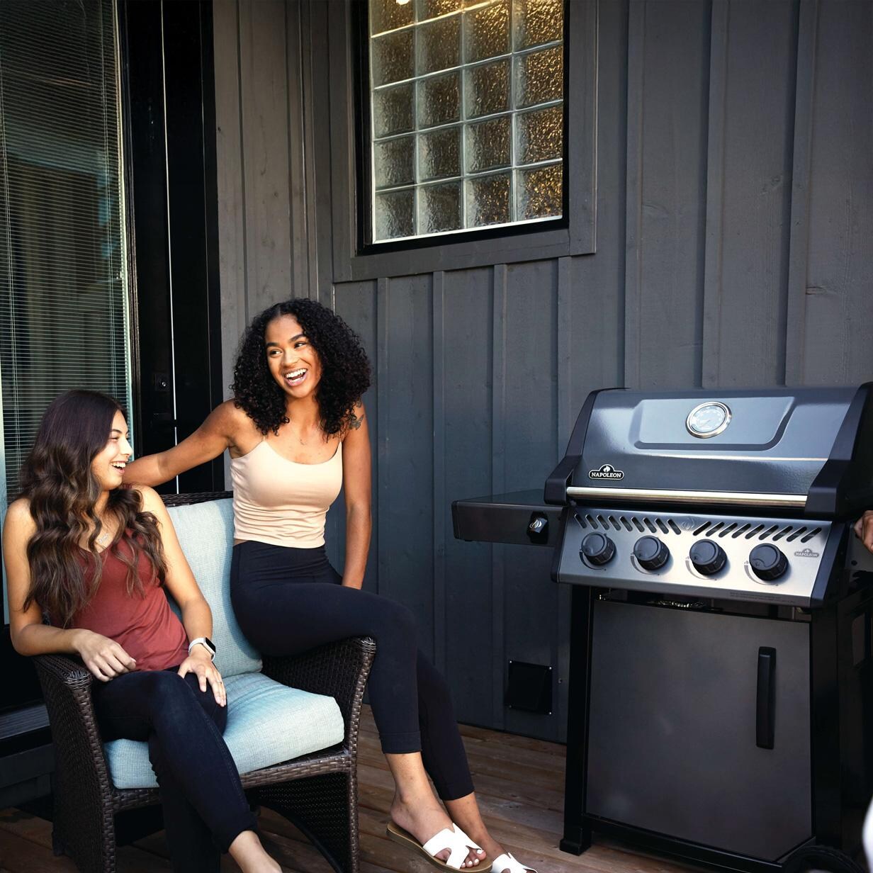 Napoleon F425DNGT Freestyle 425 4 Burner Natural Gas Grill - Graphite Grey - On Patio 2 - Lifestyle thumbnail