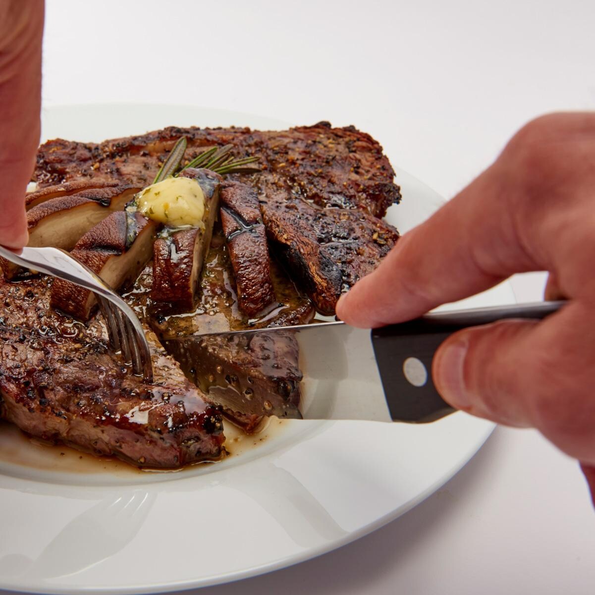 Broil King Stainless Steel Steak Knives - 4 Pack - 64935 - In Use - White Background thumbnail