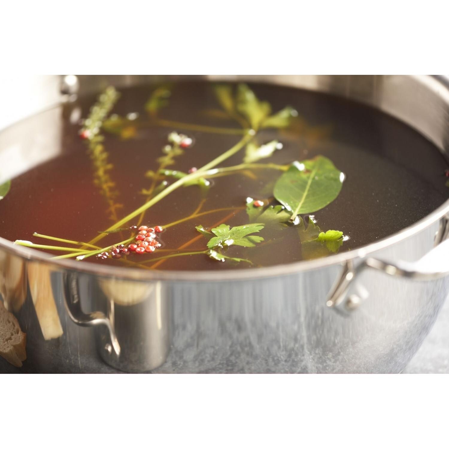 All-Clad 8-Quart Stock Pot With Lid In Use thumbnail
