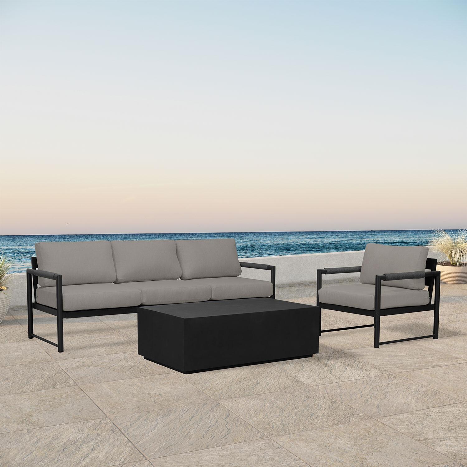 Lakeview AVEBAY-BK-CO-SET130-CC Avenue Bay Black/Carbon 3 Pc Sofa Set - Canvas Charcoal - Angled On Patio - Lifestyle thumbnail