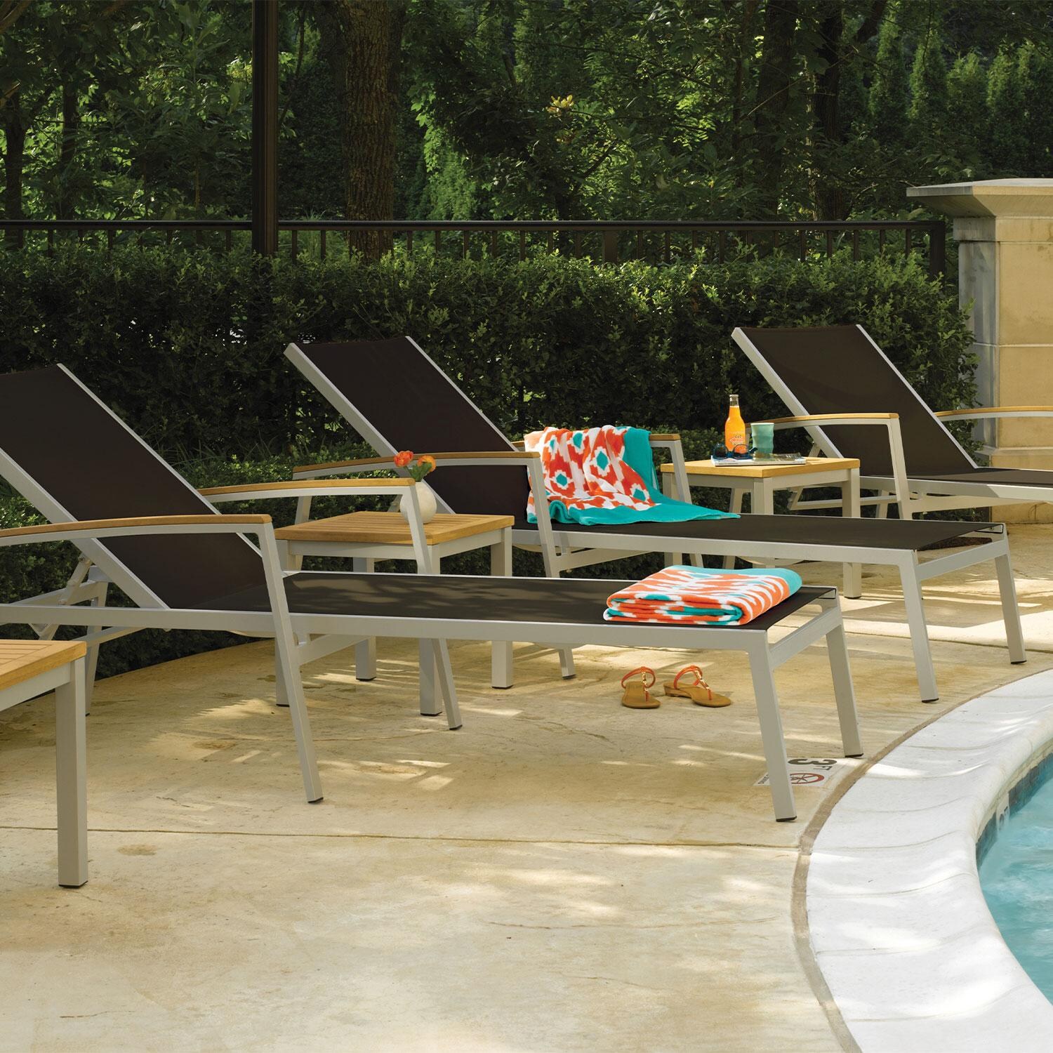 Travira 8 Pc Powder-Coated Aluminum Chaise Lounge Set in Black/Natural/Flint By Oxford Garden - Close Up - Lifestyle thumbnail
