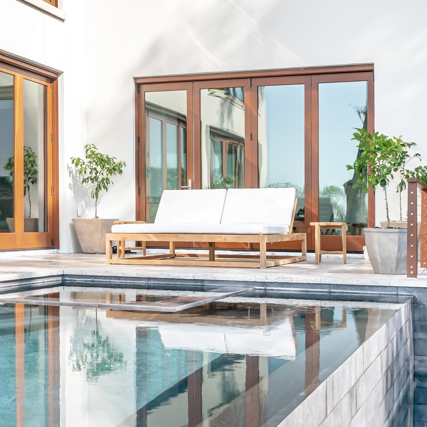 Teak + Table Atlantic Teak Patio Double Chaise Lounge in Granite - Natural cushions shown - Lifestyle thumbnail