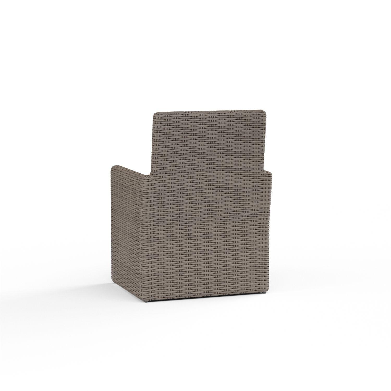 Coronado Wicker Patio Dining Arm Chair W/ Sunbrella Canvas Flax Cushion By Sunset West - Rear View - White Background thumbnail