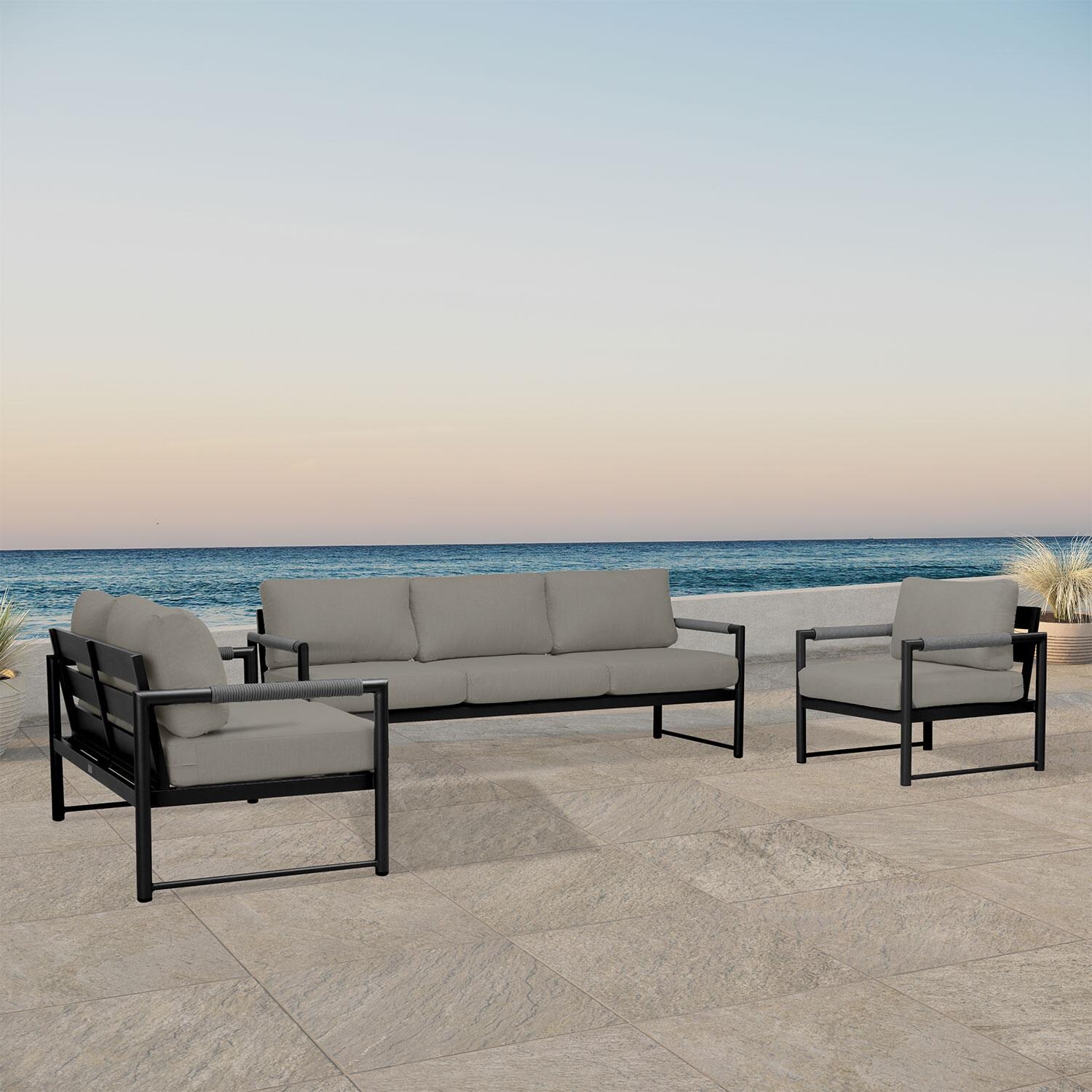 Lakeview AVEBAY-BK-CO-SET143-CC Avenue Bay Black/Carbon 3 Pc Sofa Loveseat Set - Canvas Charcoal - Angled On Patio - Lifestyle thumbnail