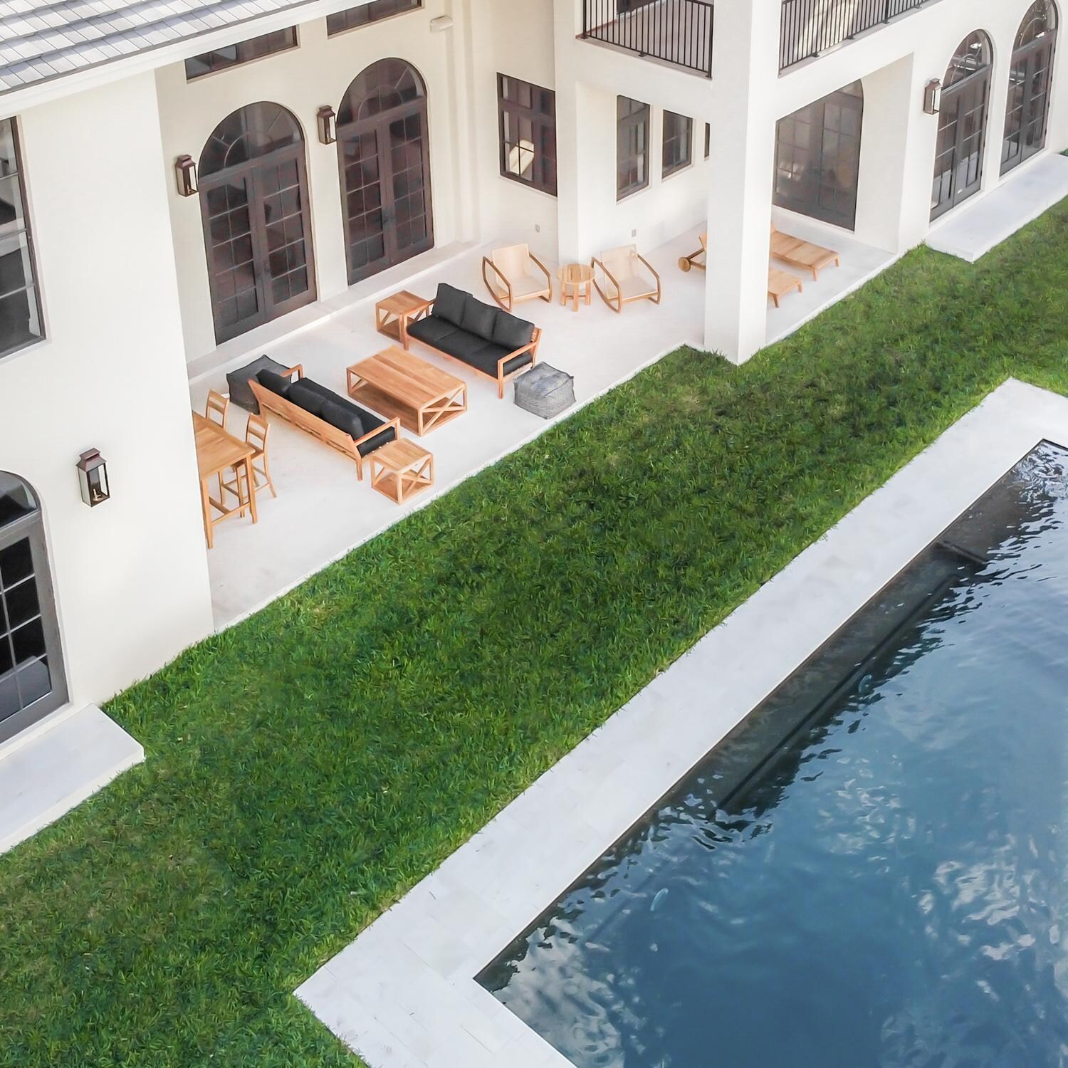 Teak + Table Monday Teak Patio Sofa in Natural - Poolside - Lifestyle thumbnail