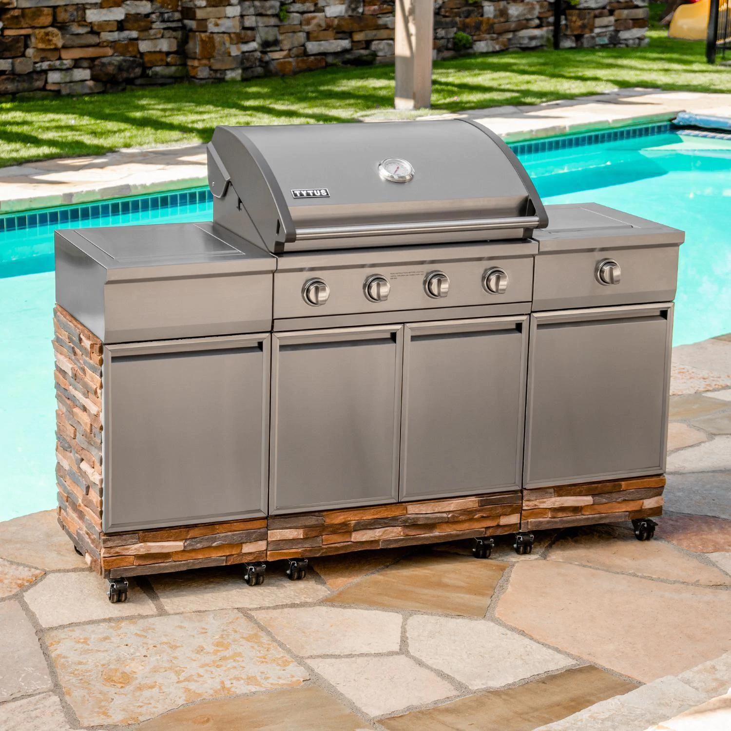 TYTUS TI404MGGLP Ash Stacked Stone 4-Burner Natural Gas Grill Island With Sear Burner & Ice Bucket (Ships as Propane with Conversion Fittings) - Angled Lifestyle View