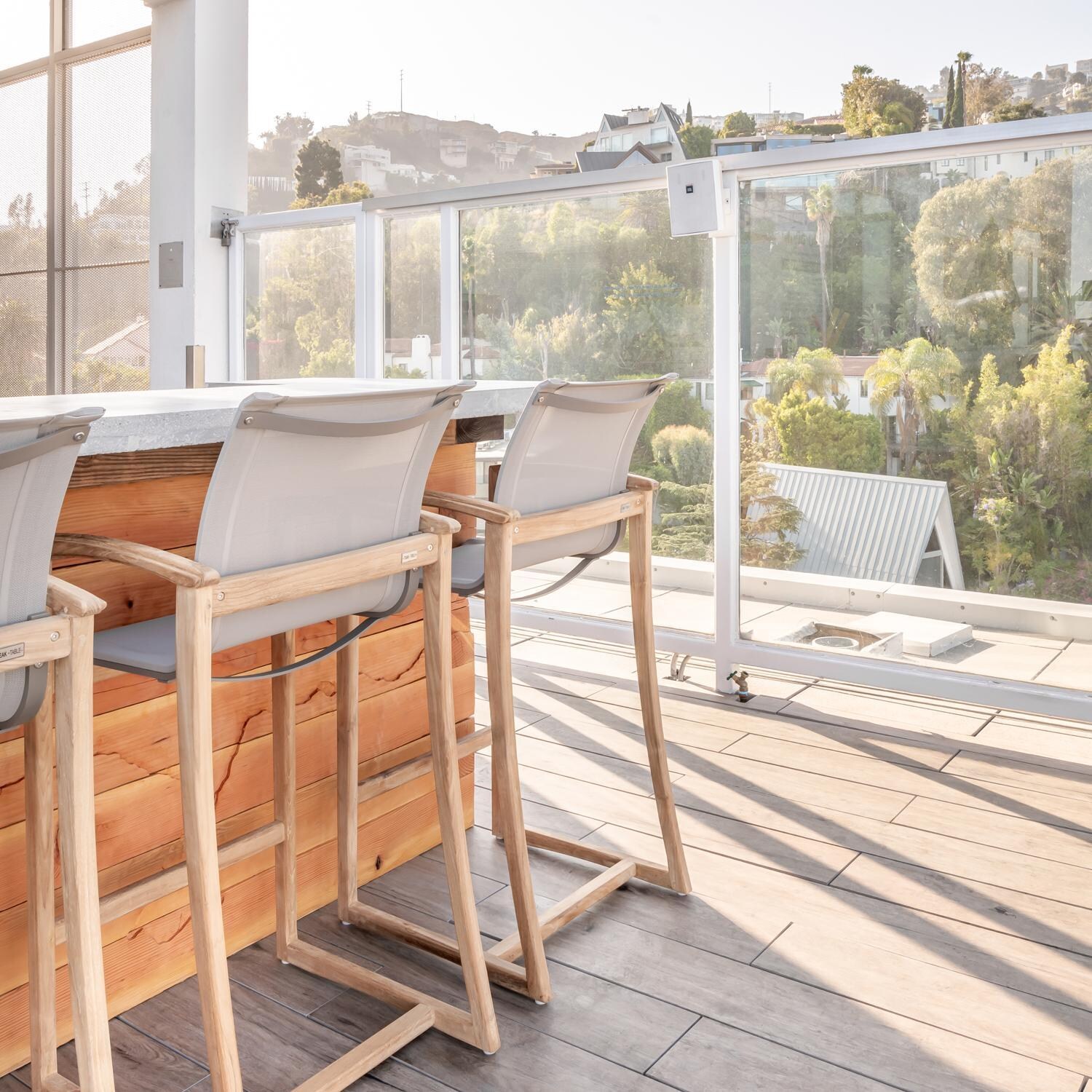 Teak + Table Capri Sling Bar Chair in Grey - Lifestyle thumbnail