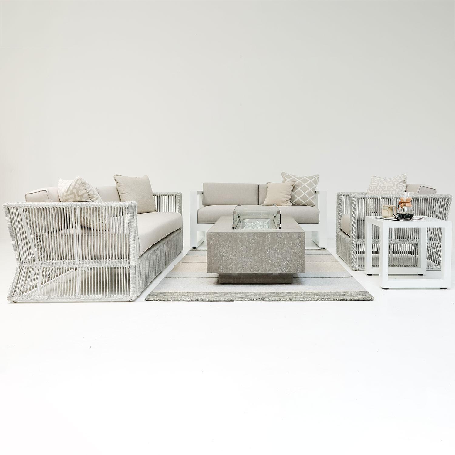 Miami Olefin Rope Patio Sofa in Dupione Celeste w/ Self Welt by Sunset West - Studio Shoot - Styled W/ Outdoor Furniture Shown in Echo Ash Cushion Color - Side View - Lifestyle thumbnail