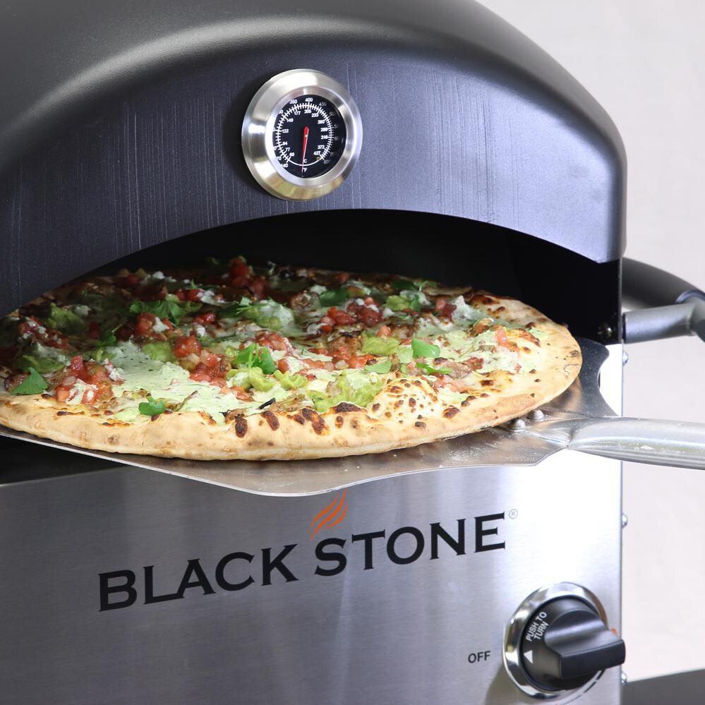 Blackstone Propane Gas Outdoor Pizza Oven On Cart - Inserting Pizza thumbnail