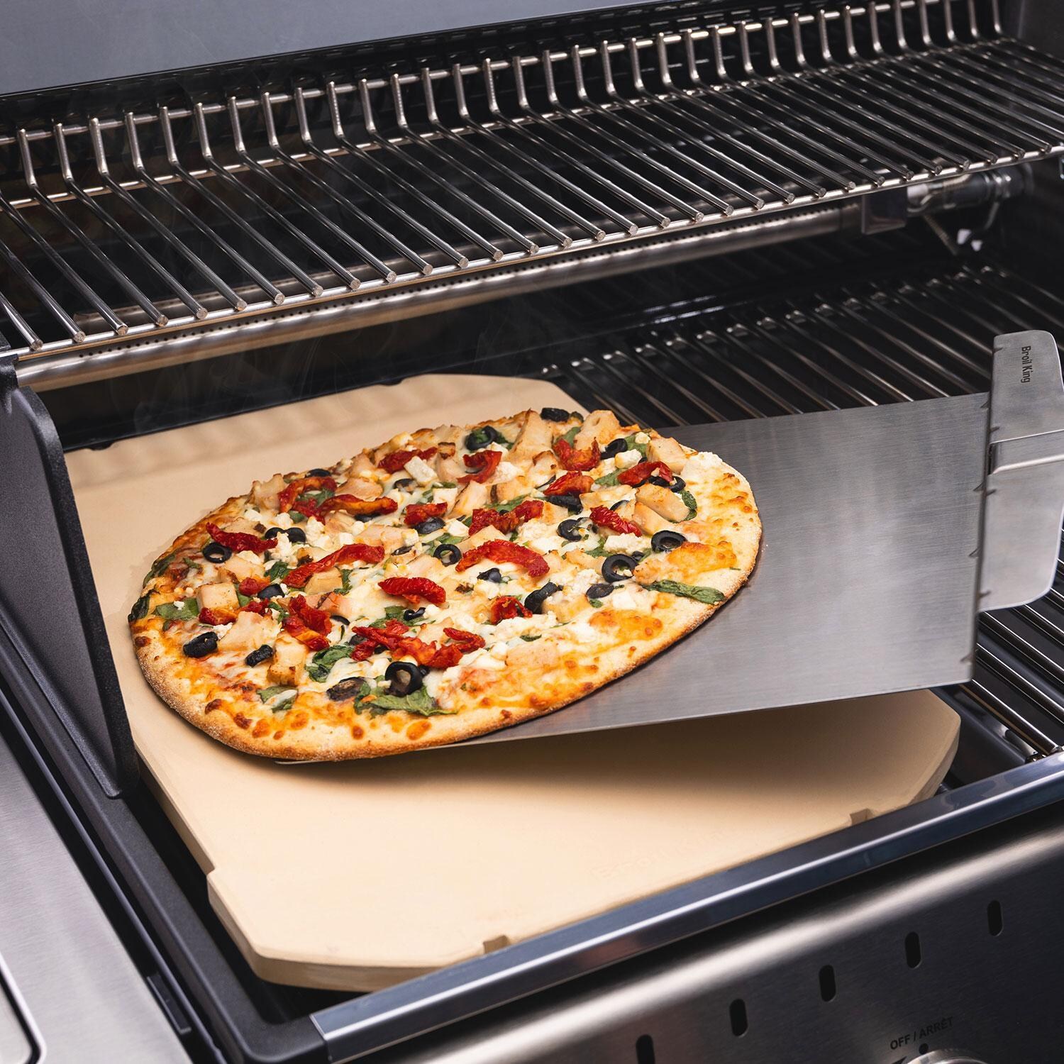 Broil King Rectangular Pizza Stone - Removing Pizza W/ Pizza Spatula - Lifestyle thumbnail