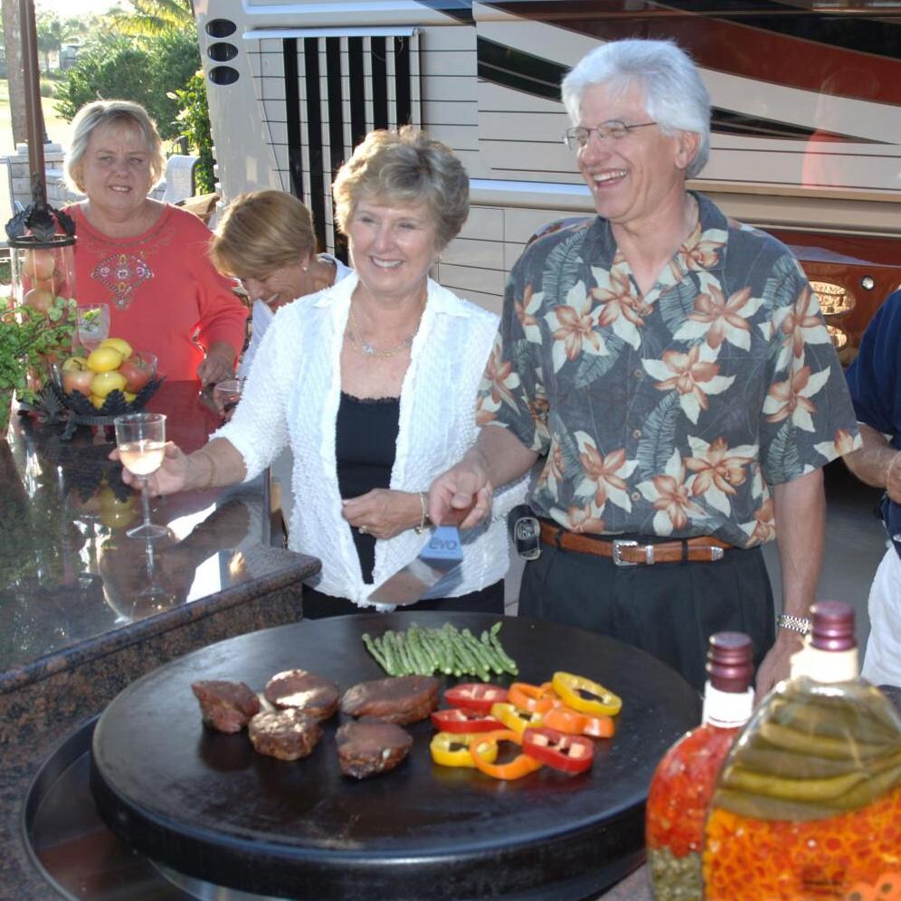 EVO 10-0055-NG Affinity 30G Built-In Flattop Natural Gas Grill w/ Non-Stick Ceramic Clad Coating - In Use at Party - Lifestyle