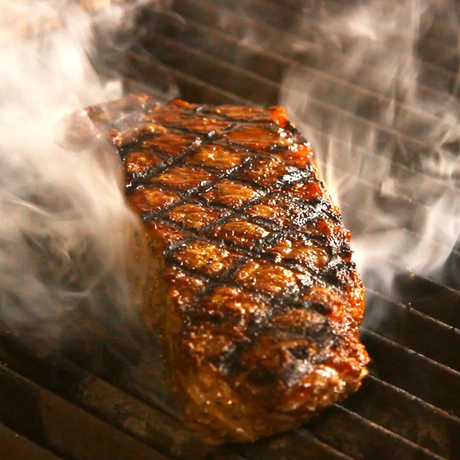 USDA Prime Dry Aged 12oz Boneless Strip Steaks By Chicago Steak Company - Shown on the Grill thumbnail