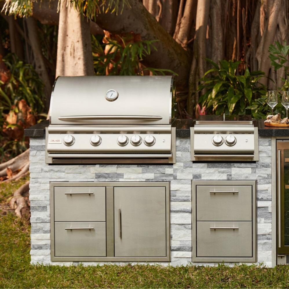 Blaze BLZ-4LTE3-LP Premium LTE+ 32-Inch 4-Burner Built-In Propane Grill With Rear Infrared Burner & Lift-Assist Hood  - Front View - Lifestyle