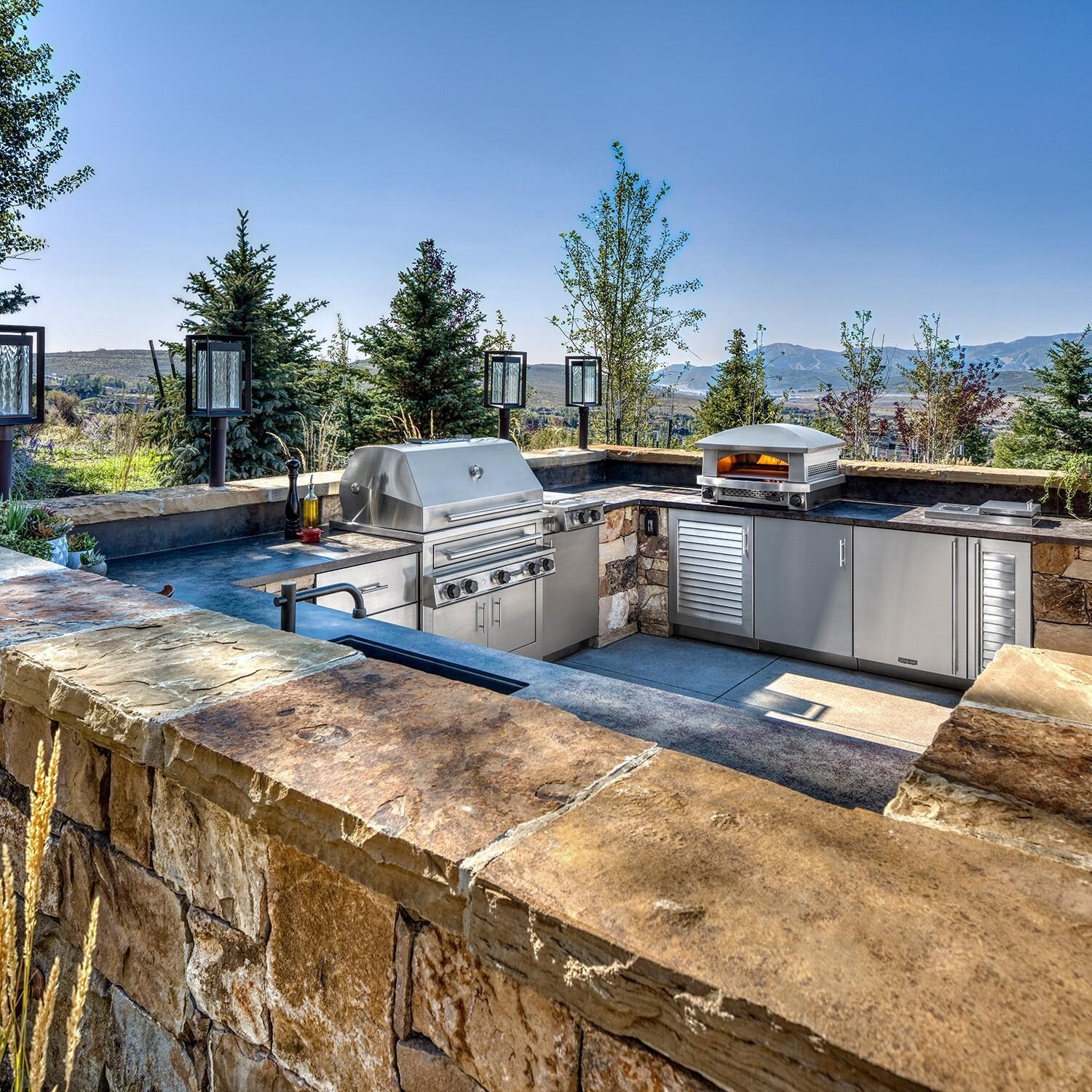 Kalamazoo K750HB Hybrid Fire Three Burner Marine Grade Built-In Natural Gas Grill W/ Two Plancha Surface Grates - In Outdoor Kitchen w/ CKTPD Cooktop, AFPO Pizza Oven & K-SMOKE2 Smoker Cabinet - Lifestyle thumbnail