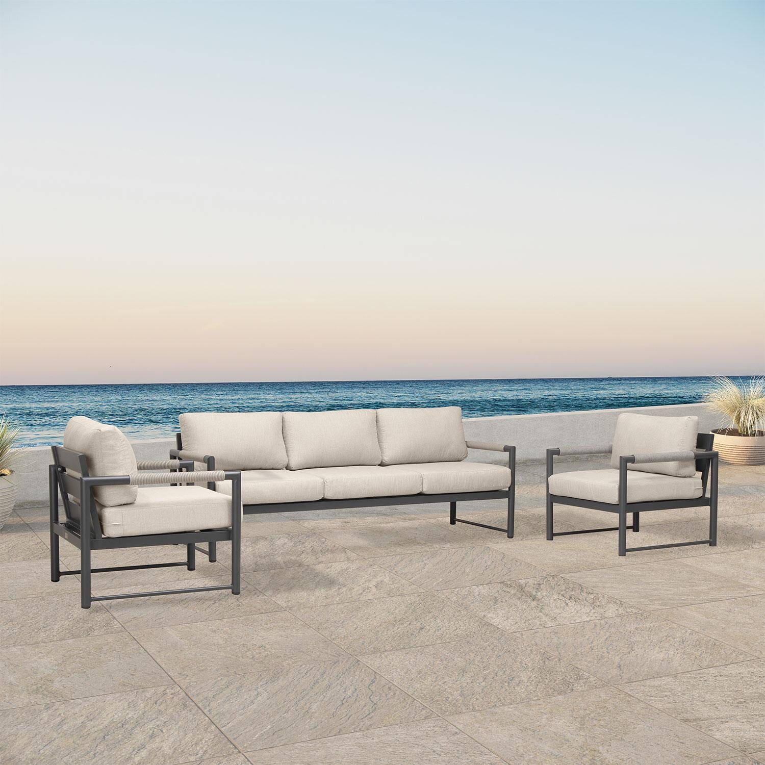 Lakeview AVEBAY-SL-PG-SET141-CF Avenue Bay Slate/Pebble Gray 3 Pc Sofa Club Chair Set - Canvas Flax - Angled On Patio - Lifestyle thumbnail