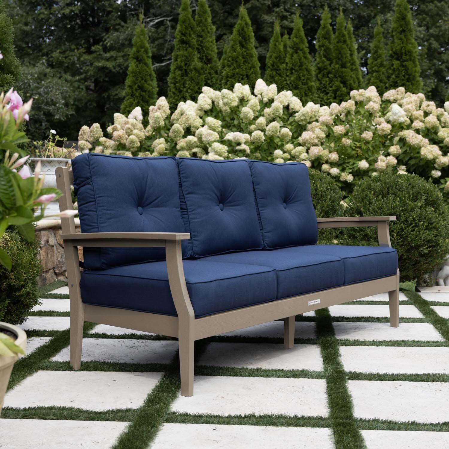Blushing Bay 3 Person Recycled Plastic Sofa in Spectrum Indigo/Woodland Brown by Lakeview Outdoor Designs - Side View - Lifestyle thumbnail