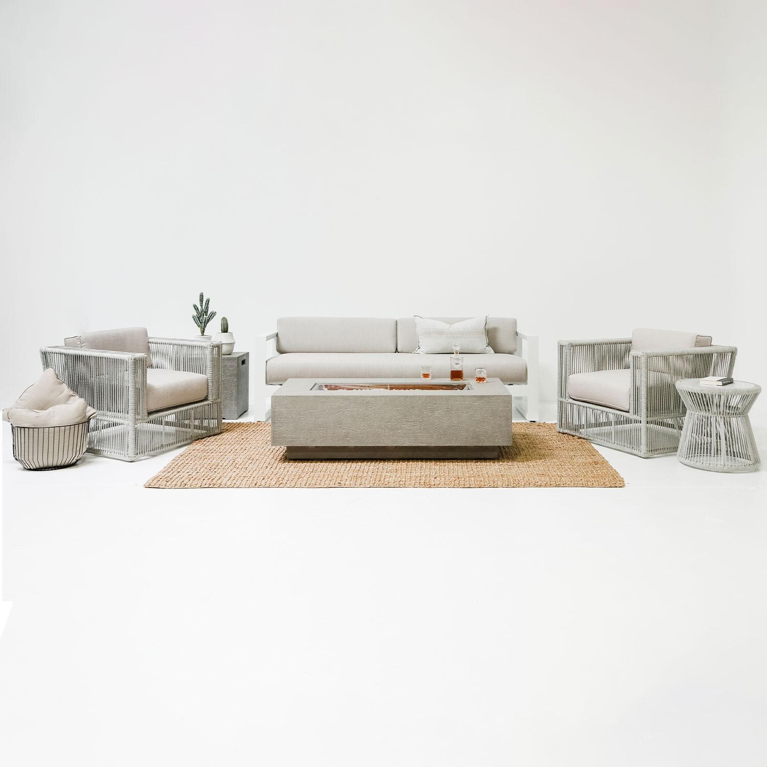 Miami Olefin Rope Patio Sofa in Dupione Celeste w/ Self Welt by Sunset West - Studio Shoot - Styled W/ Outdoor Furniture Shown in Echo Ash Cushion Color - Front View - Lifestyle thumbnail