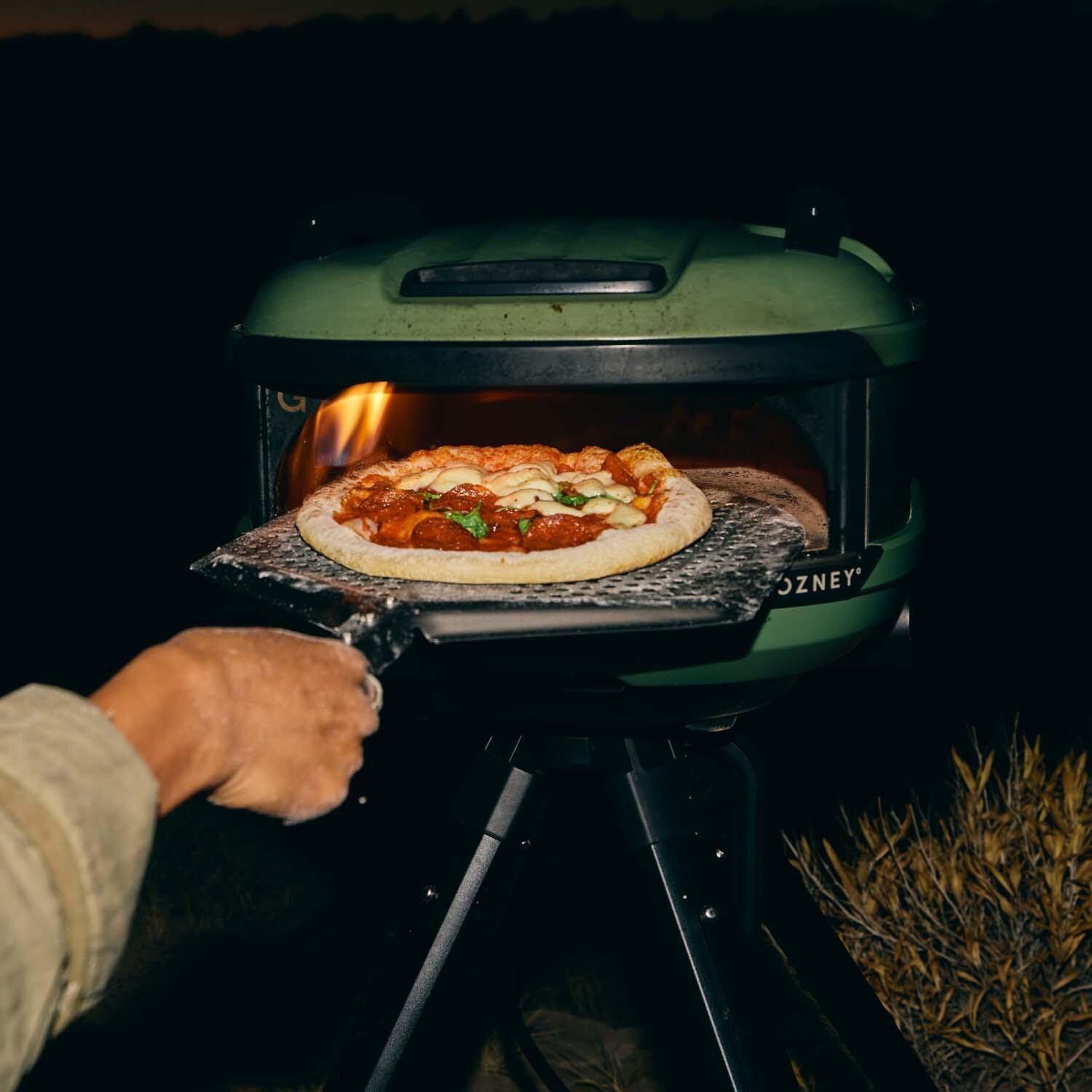 Gozney GTPOBUS1225 Black Tread Propane Pizza Oven Bundle - Included AT1963 Placement Peel - Shown w/ Olive Oven - Lifestyle thumbnail