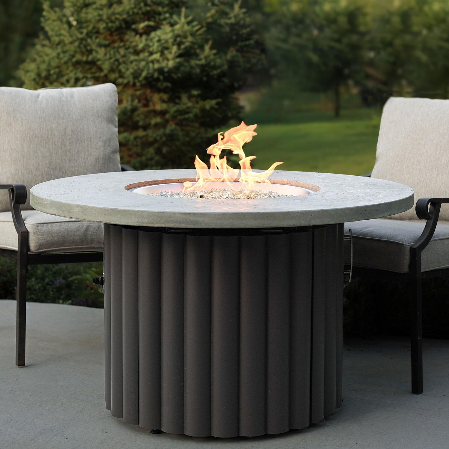 Reverie REVRCH-42-K-NG 42-in Round Aluminum Natural Gas Fire Pit Table w/ Relic Grey Supercast Top & Charcoal Base (Ships Propane w/ Conversion Kit) - Lifestyle thumbnail