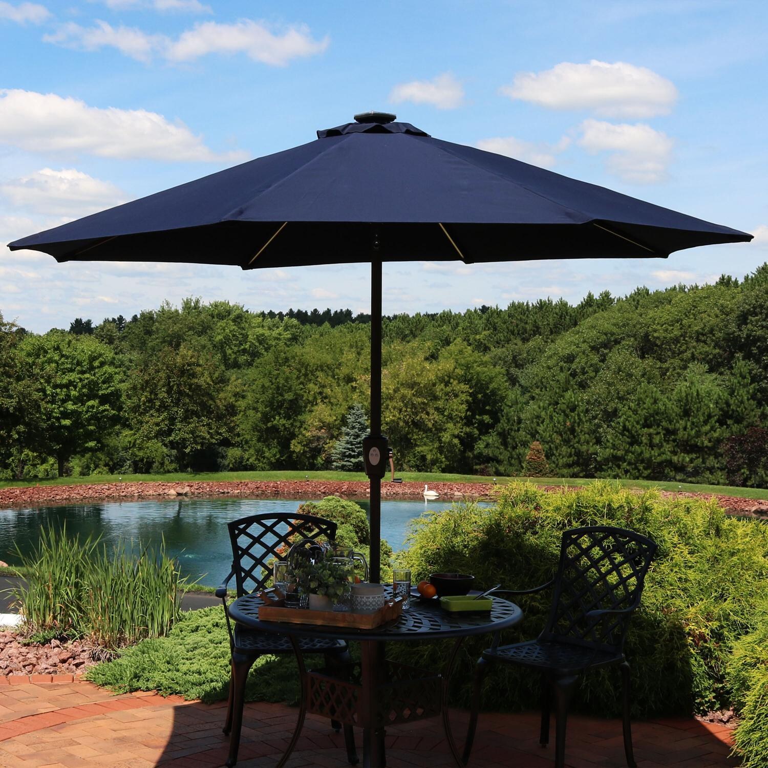 Ultimate Patio 9 Ft. Solar Lighted Patio Umbrella W/ Crank & Tilt - Navy Blue - Lifestyle View thumbnail