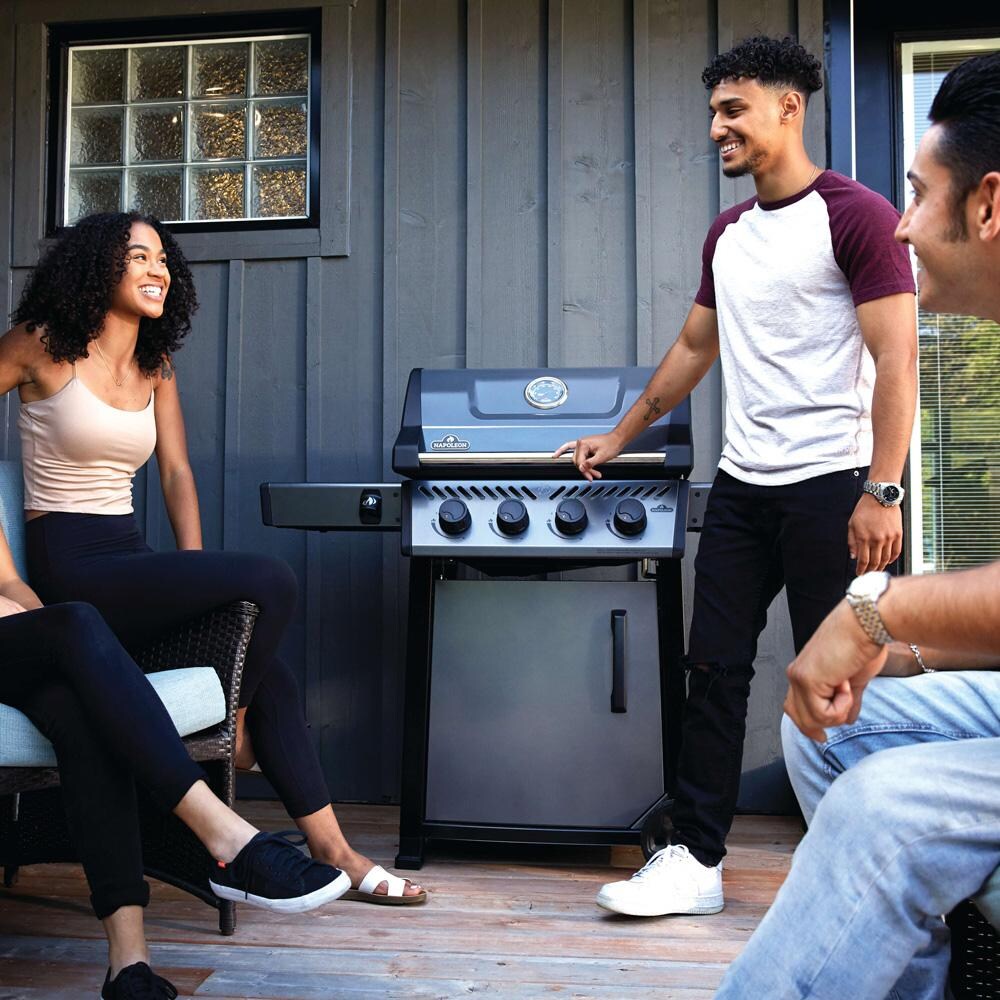 Napoleon F425DPGT Freestyle 425 4 Burner Propane Gas Grill - Graphite Grey - On Patio - Lifestyle thumbnail