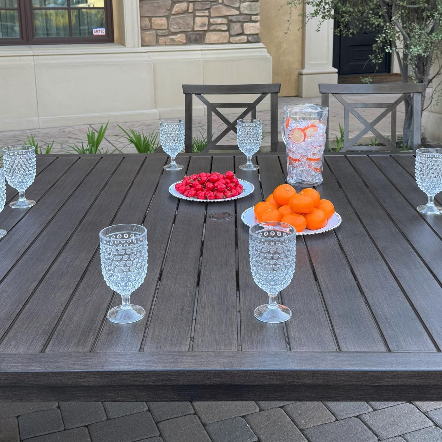 Atlantis 8 Pc Aluminum Dining Set w/ 2 Dining Side Chairs, 4 Swivel Rocker Dining Arm Chairs & Two Person Bench in Walnut/Beige by Darlee - Table Top - Lifestyle thumbnail