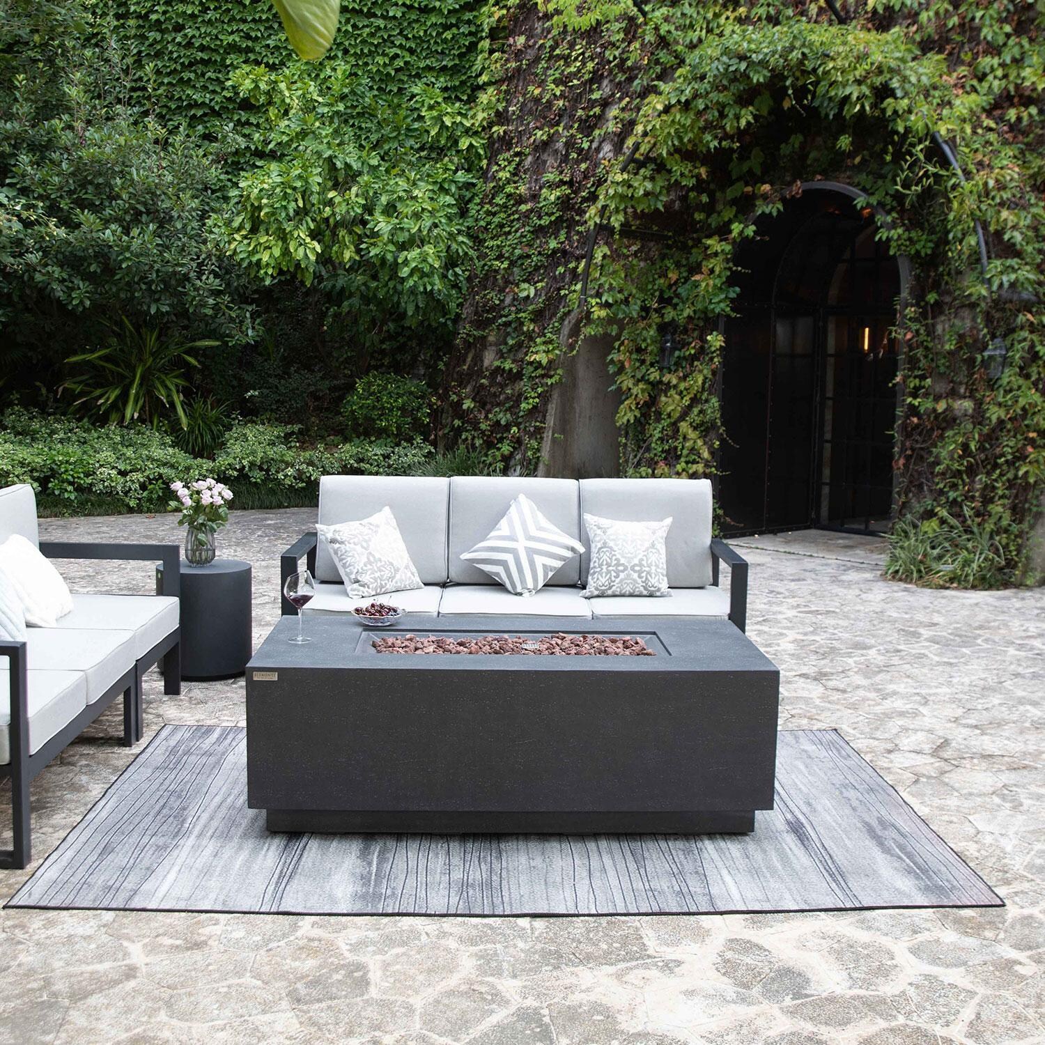 Andes 66 Inch Hidden Tank Rectangle GFRC Concrete Natural Gas Fire Table in Dark Gray By Elementi - Display - Lifestyle thumbnail