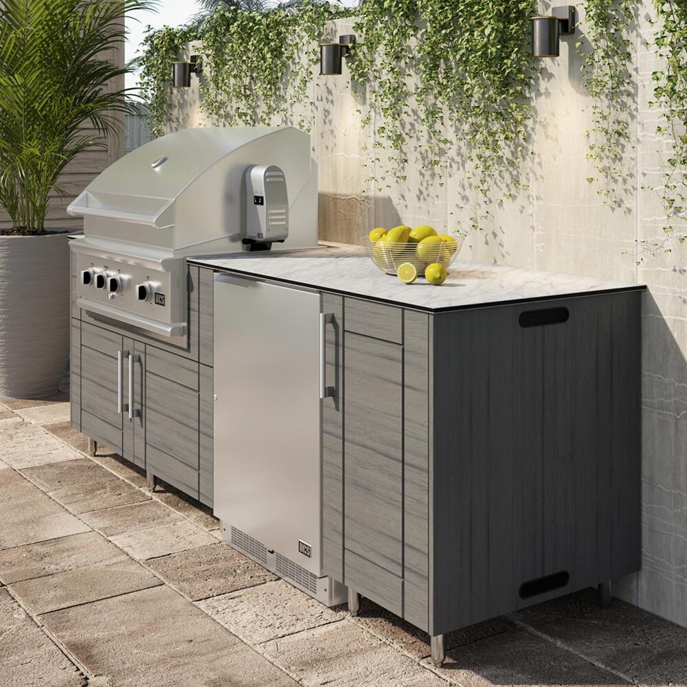 WeatherStrong Bimini 7 1/2 Ft Outdoor Kitchen Island w/ Blaze Propane Grill & Refrigerator in Dark Ash/Glacier Frost - On Patio - Lifetyle thumbnail