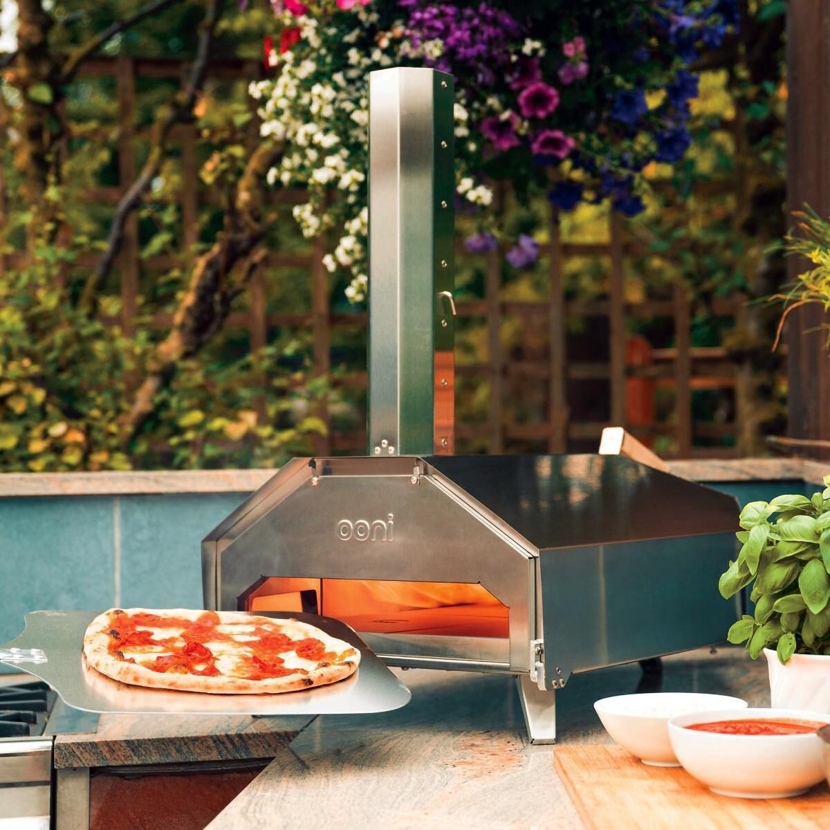 Ooni Pro Stainless Steel Multi-Fuel Pizza Oven - Lifestyle View W/ Door With Thermometer thumbnail
