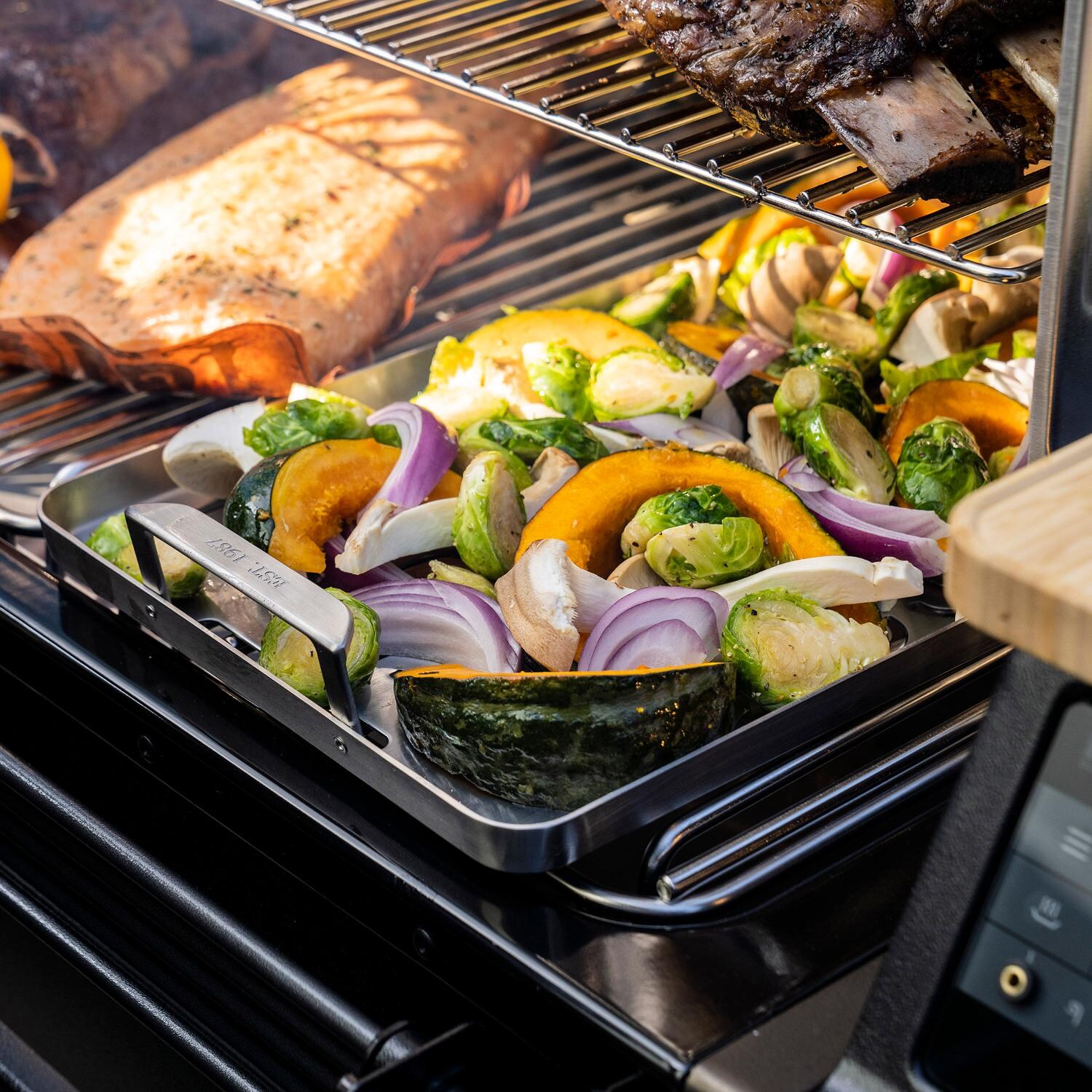 Traeger BAC610 ModiFIRE Fish & Veggie Stainless Steel Grill Tray - Holding Roasted Veggies thumbnail