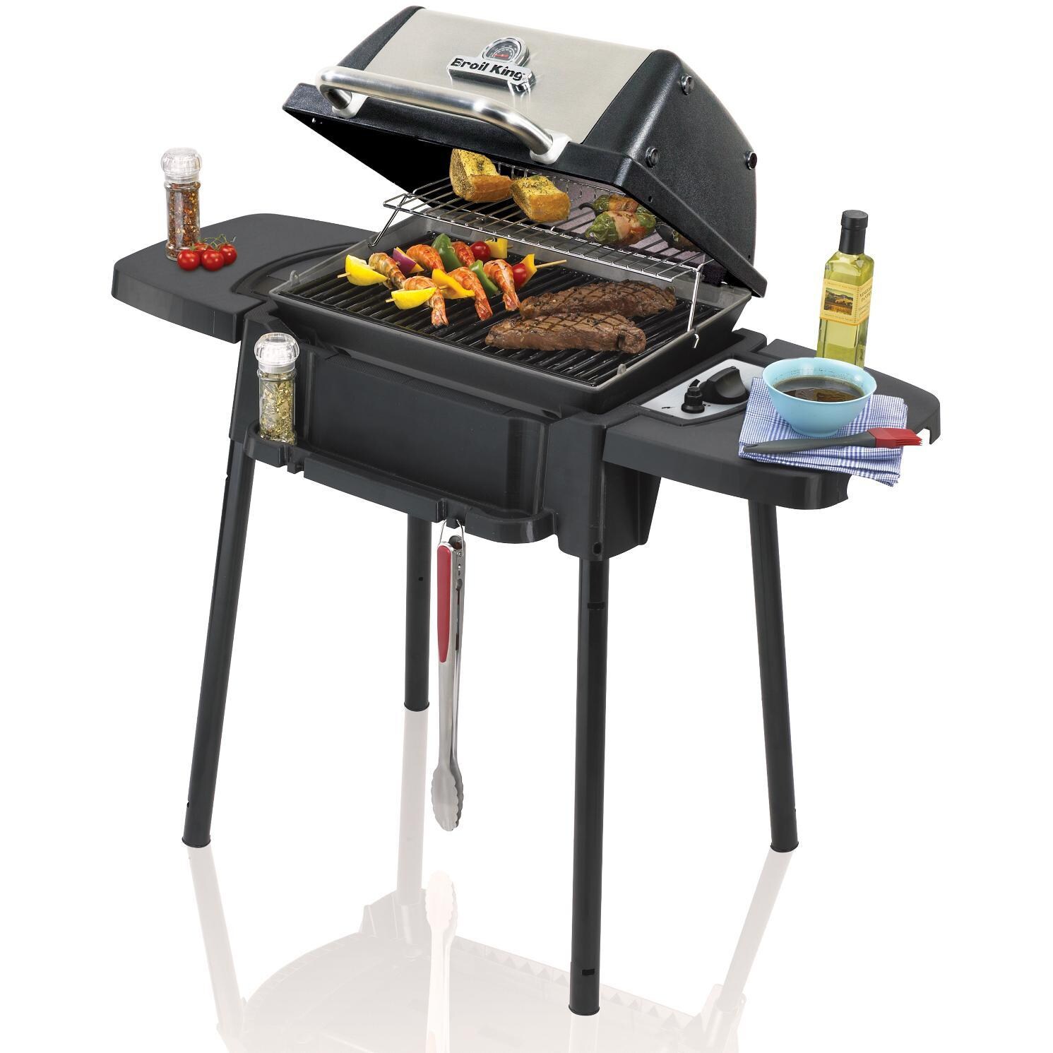Broil King Porta-Chef 120 Portable Propane Gas Grill - Angled View With Food - White Background thumbnail