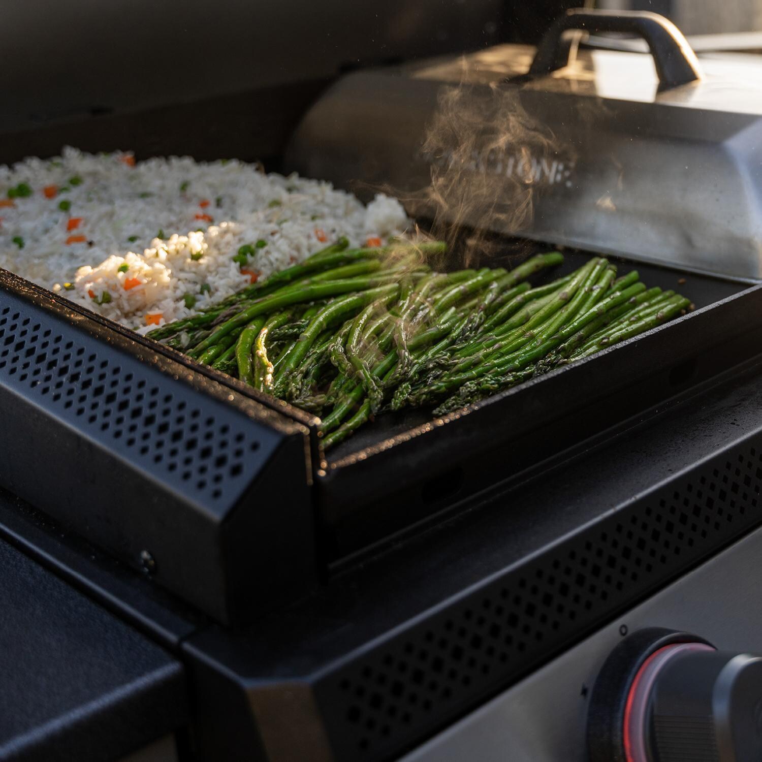 Blackstone 6128 28 Inch XL Built-In Propane Griddle W/ Hood - Grill In Use Side View - Lifestyle thumbnail