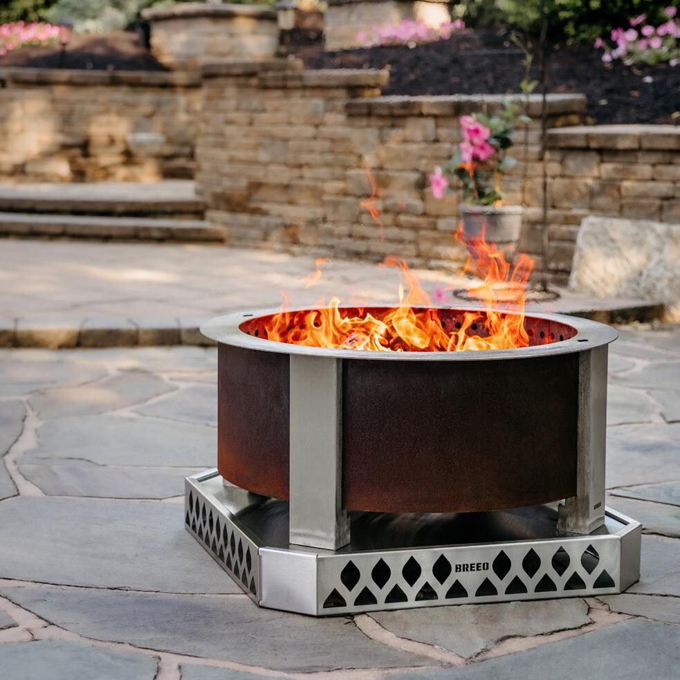Breeo BR-XS30-SSBA X Series 30 Inch Stainless Steel Fire Pit Base - On the Patio Angled - Lifestyle thumbnail