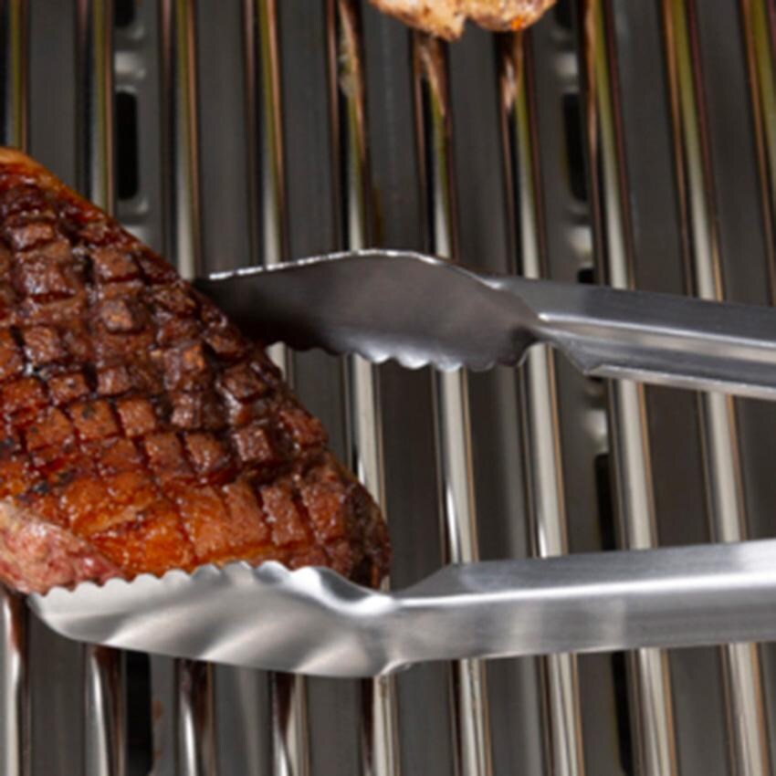 Broil King Stainless Steel 16-in Precision Baron Tongs - 64037 - Grabbing Steak - Lifestyle thumbnail