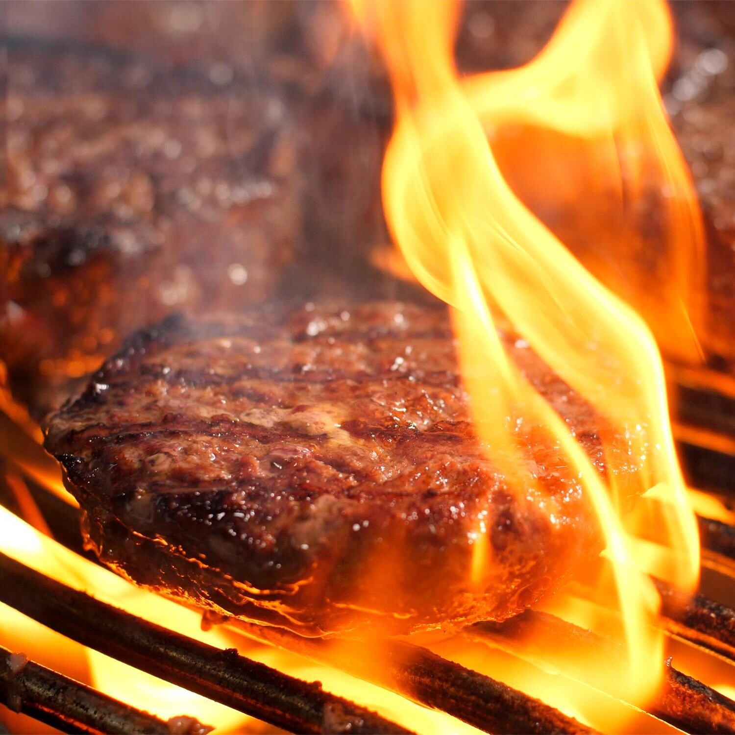 Napoleon LEX485RSIBPSS-1 LEX 485 Propane Gas Grill With Infrared Rear Burner And Infrared Side Burner - Grilling Burgers On The Napoleon Wave Cooking Grids - Detail thumbnail