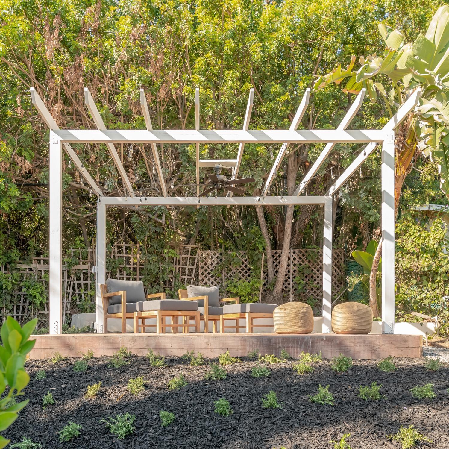 Teak + Table Monday Teak Patio Ottoman in Natural - Garden Patio - Lifestyle thumbnail